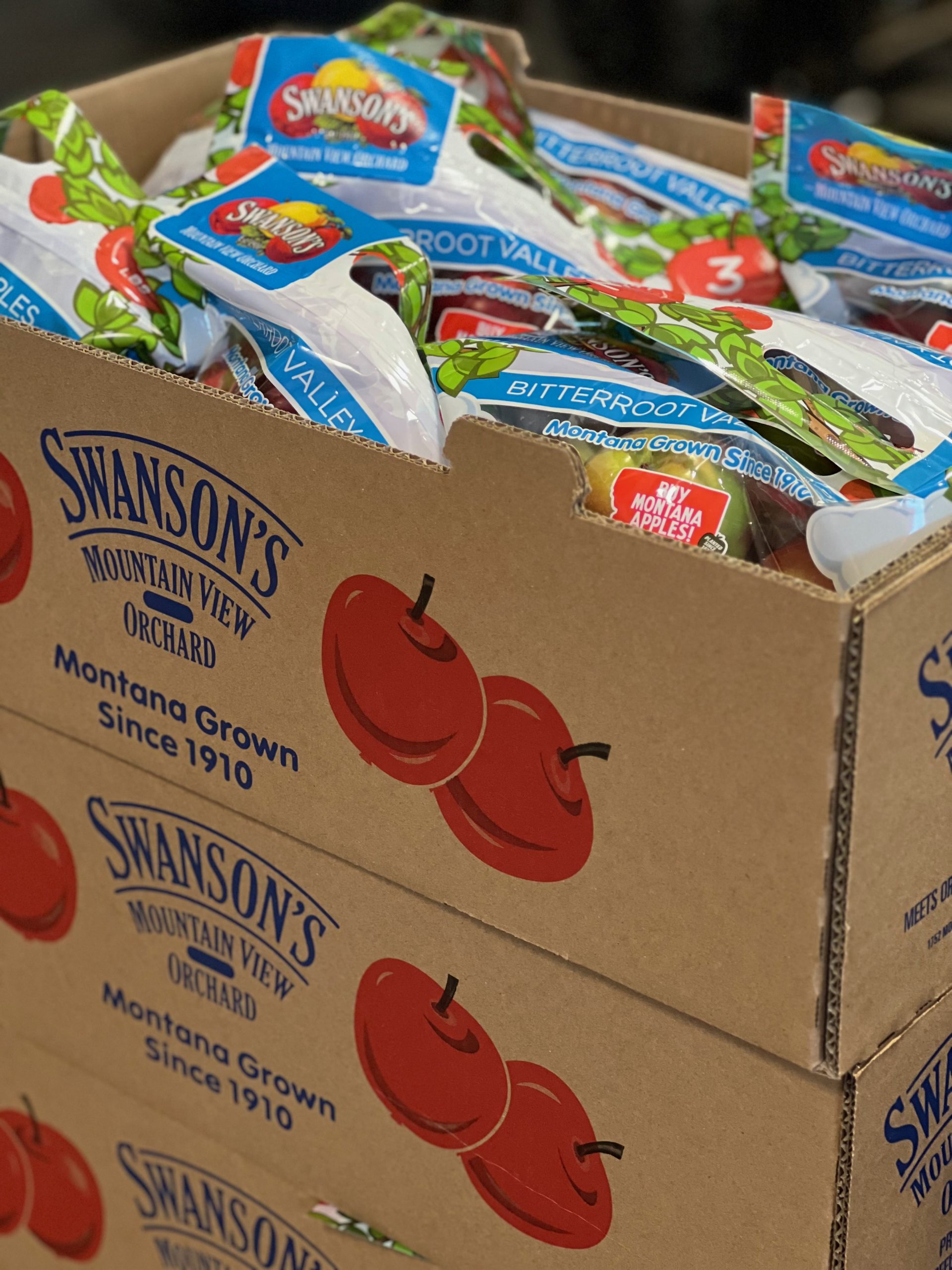 Boxes of 3 pound bags of red McIntosh apples from Swanson's Mountain View Orchard in the Bitterroot Valley