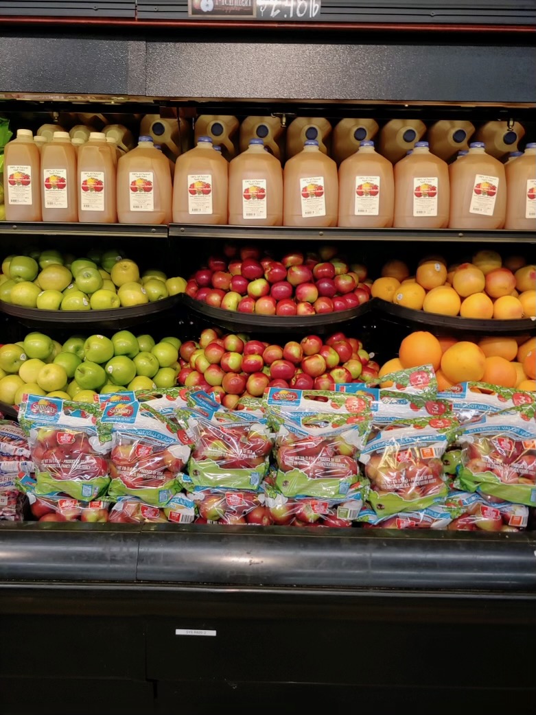Swanson's apple bags and apple cider displayed in a grocery store